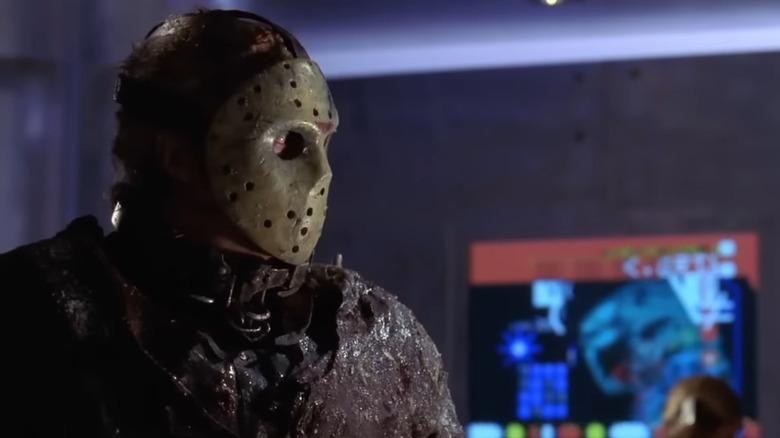 Jason X looking at a woman using a computer