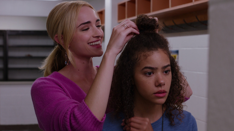 Brianne Howey and Antonian Gentry fixing hair Ginny & Georgia