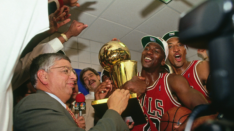 Michael Jordan holding trophy in The Last Dance