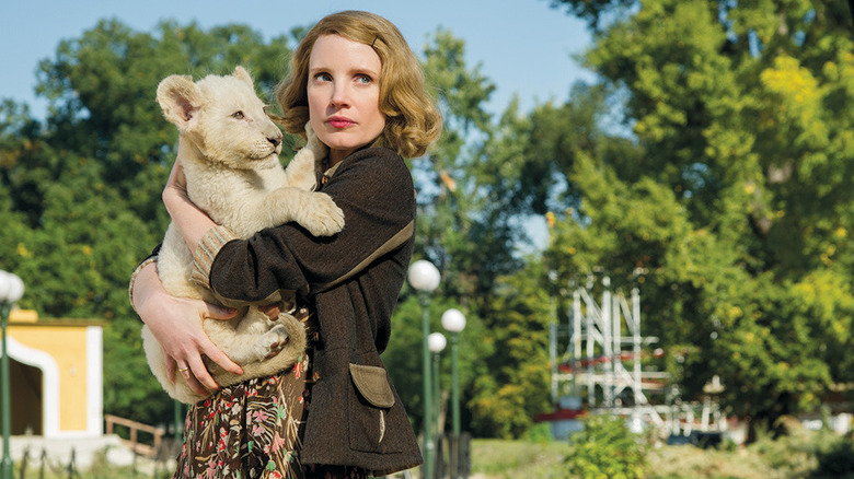 Jessica Chastain holds lion in The Zookeeper's Wife