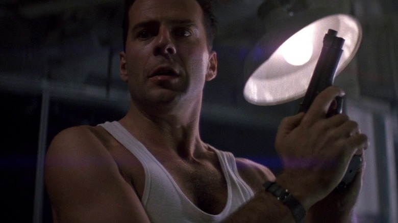 Bruce Willis in his famous undershirt, ready for action