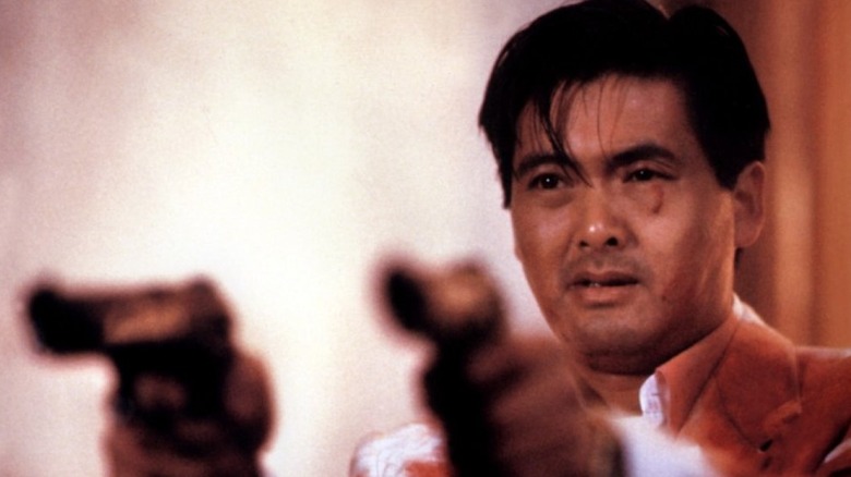 Chow Yun-fat with pistols akimbo