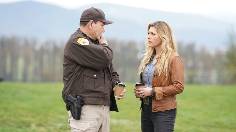 Jenny and Sheriff Walter in field in Big Sky (2020)