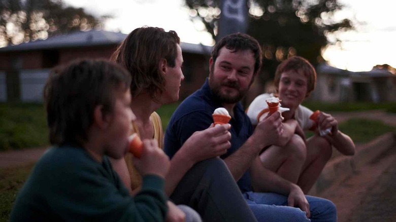 Young men eating ice cream