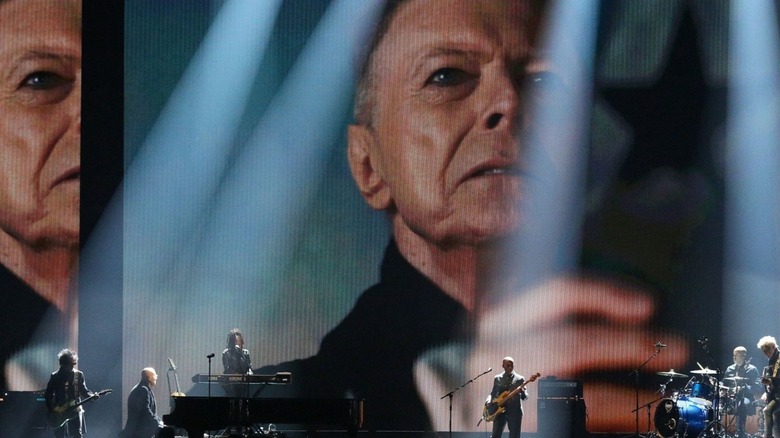 David Bowie singing into camera