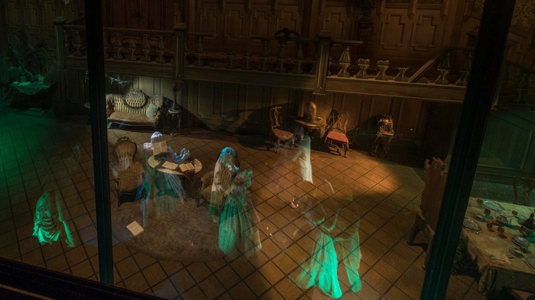 Ghosts dancing in Haunted Mansion ballroom