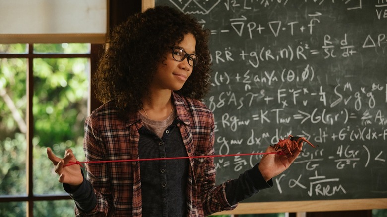 Storm Reid in A Wrinkle in Time playing with string