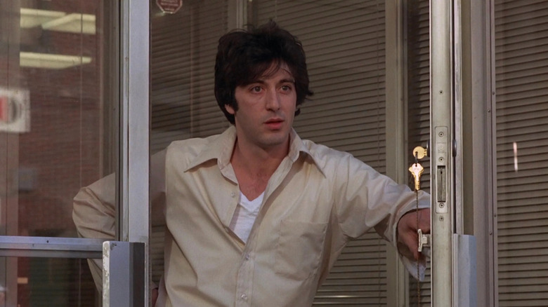 A disheveled Sonny Wortzik (Al Pacino) opens a bank door in Dog Day Afternoon