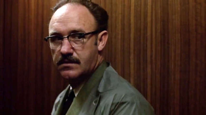 Harry Caul (Gene Hackman) looks inquisitively to his left in The Conversation