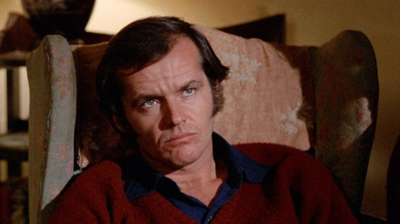 Bobby Dupea (Jack Nicholson) sits in an armchair in Five Easy Pieces