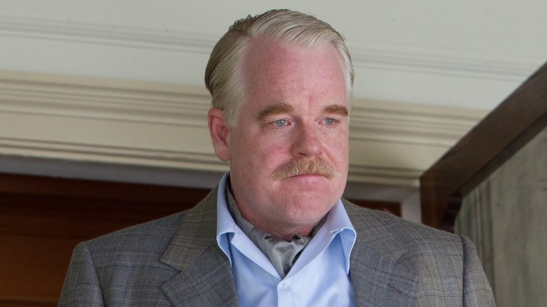 Lancaster Dodd (Philip Seymour Hoffman) stands with tears in eyes in The Master