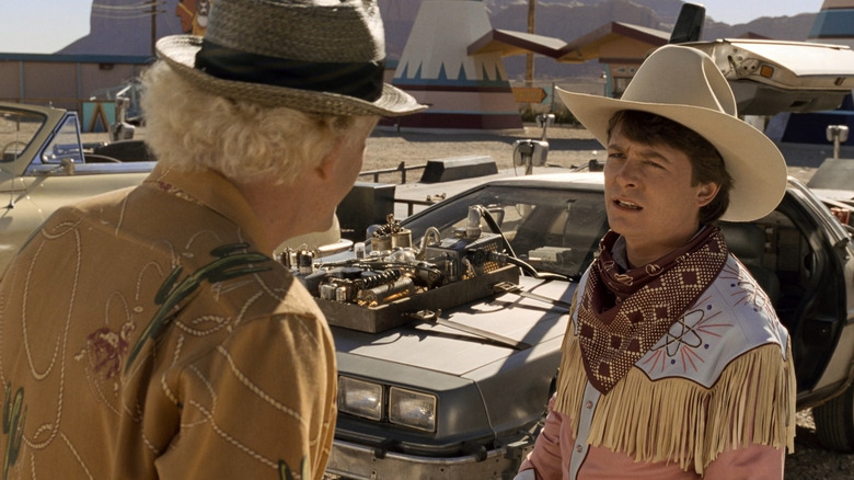 Doc Brown and Marty in front of the DeLorean in the old West