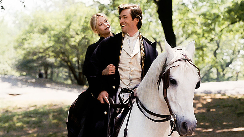 Kate and Leopold riding a horse through Central Park