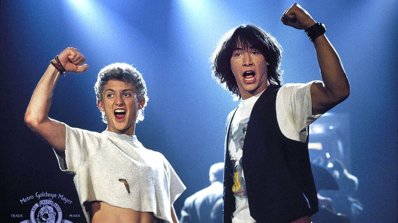 Bill and Ted on stage pumping their fists