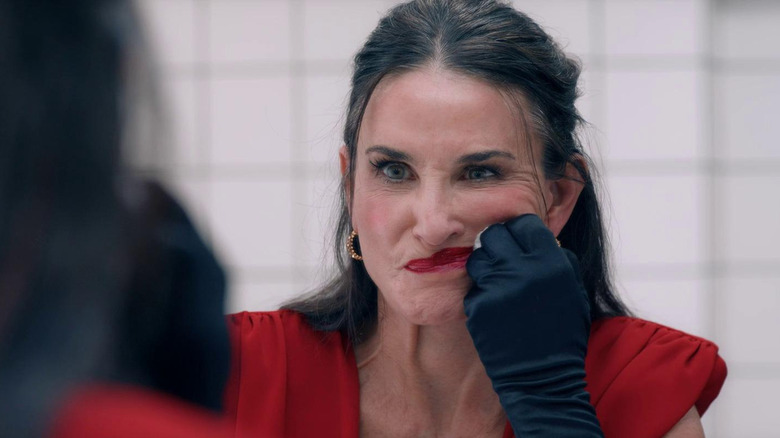 Demi Moore wiping makeup in The Substance