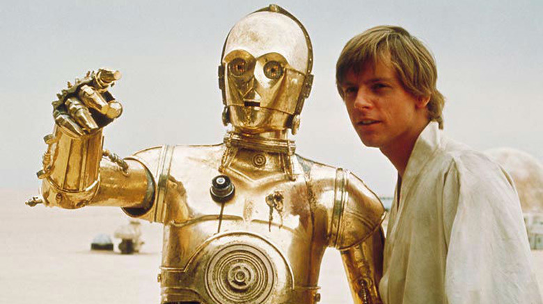 C-3PO talking to Luke