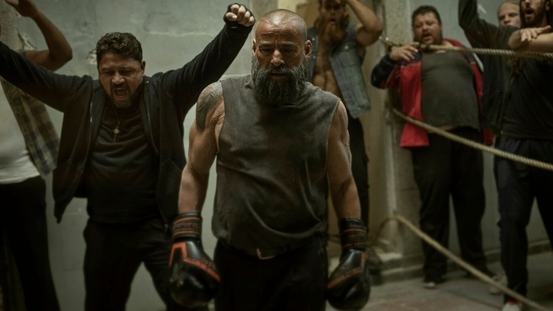 Father Vergara (Eduard Fernández) also dabbles in boxing in HBO Max's "30 Coins"