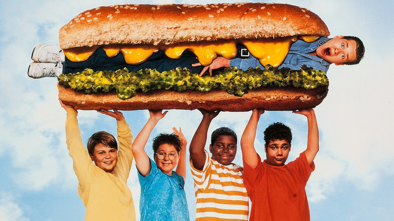 The campers holding up a sandwitch with Lars in it on the poster for Heavyweights