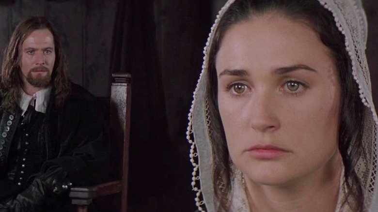 Gary Oldman as Rev. Arthur Dimmesdale stares at Demi Moore as Hester Prynne in The Scarlet Letter