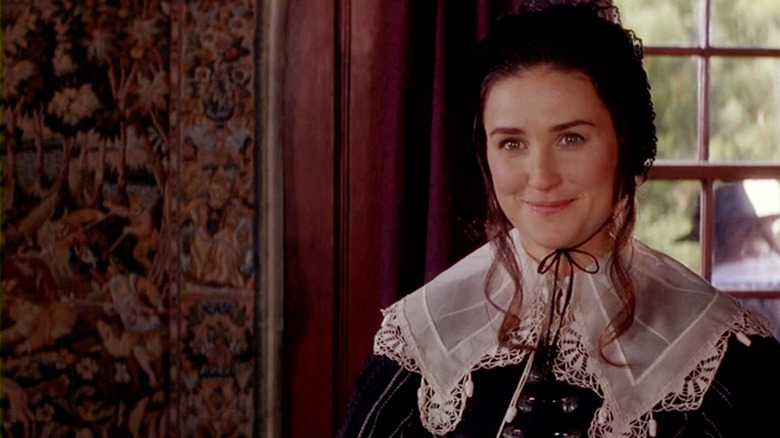 Demi Moore as Hester Prynne smiling in The Scarlet Letter