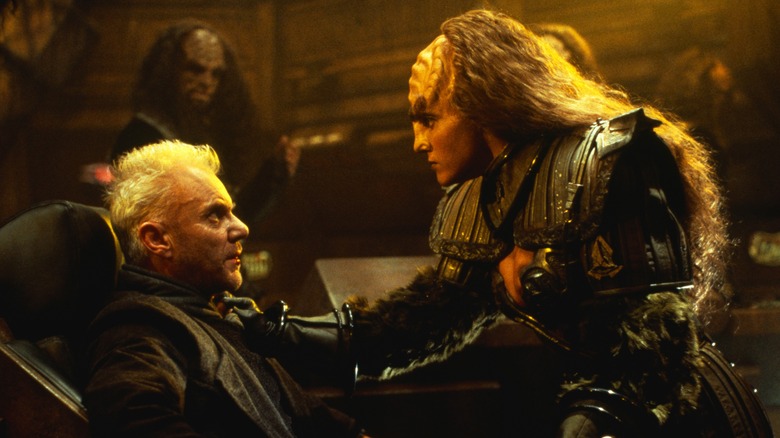 Malcolm McDowell as Soran being threatened by a Klingon in Star Trek: Generations