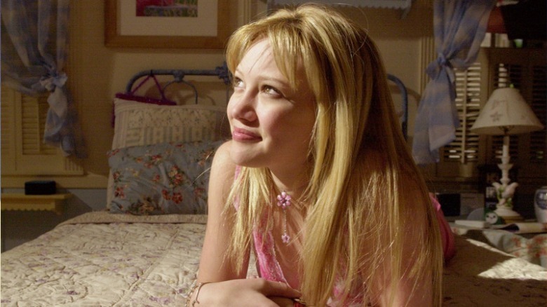 Lizzie McGuire laying on bed