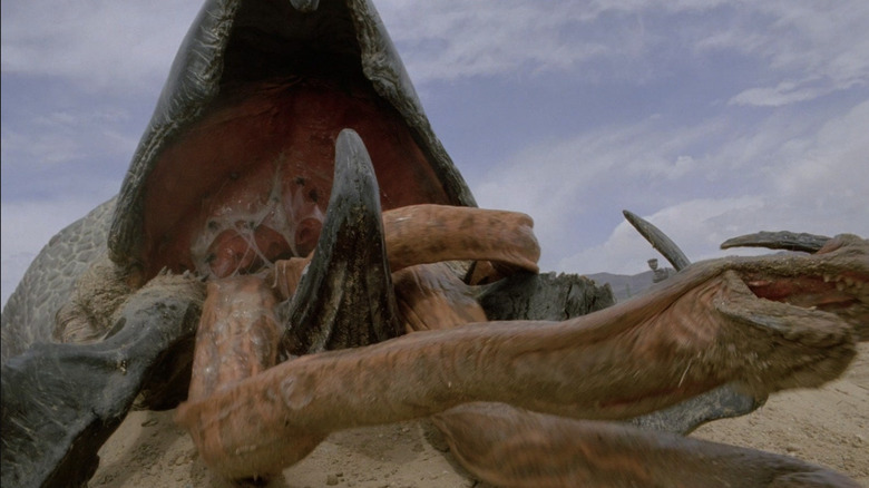 a Graboid bursting through the ground in Tremors