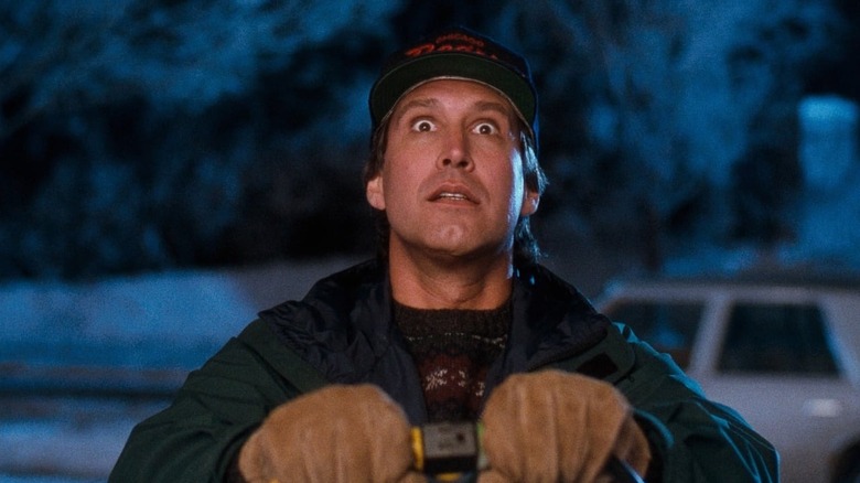 Chevy Chase as Clark Griswold plugging in his lights in National Lampoon's Christmas Vacation