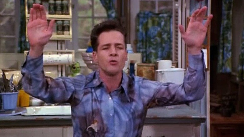 French Stewart with hands in air 3rd Rock from the Sun