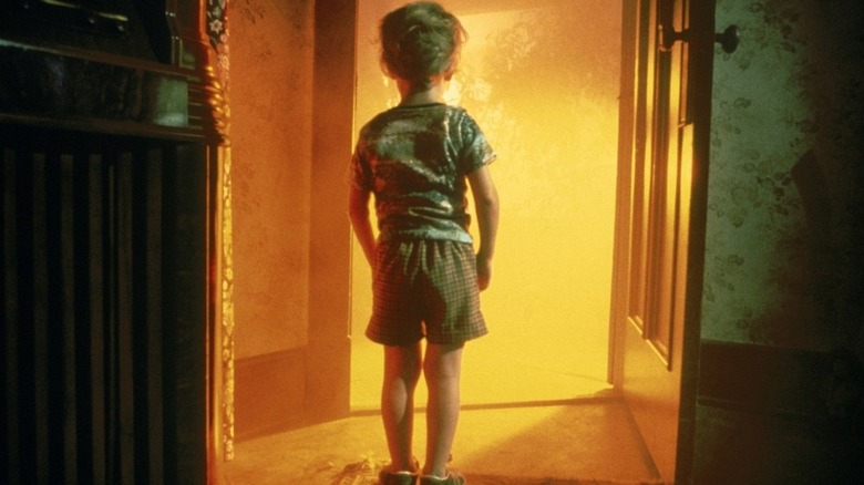 Child in glowing doorway