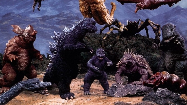 Godzilla surrounded by monsters