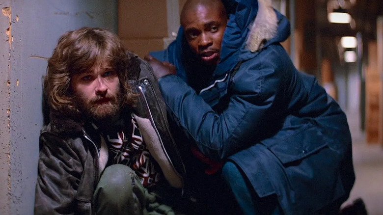 MacReady and Childs crouching down scared