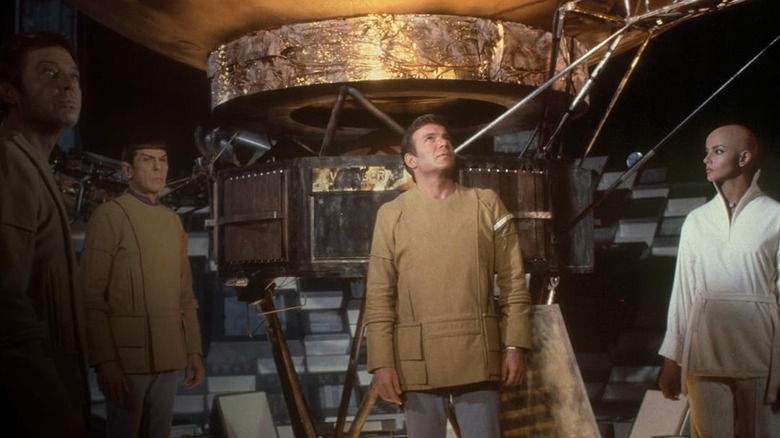 Bones, Spoke, Kirk, and Ilia standing by the Voyager 6 in Star Trek: The Motion Picture