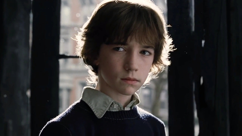 Liam Aiken as Klaus, who looks skeptical in A Series of Unfortunate Events