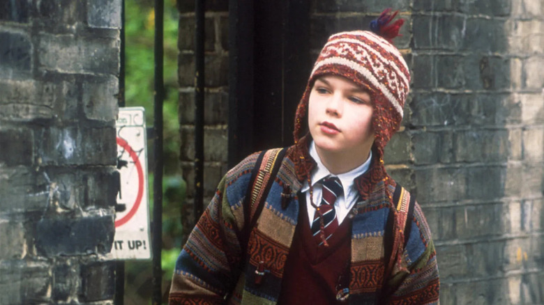 Nicholas Hoult as Marcus wearing a winter hat in About a Boy