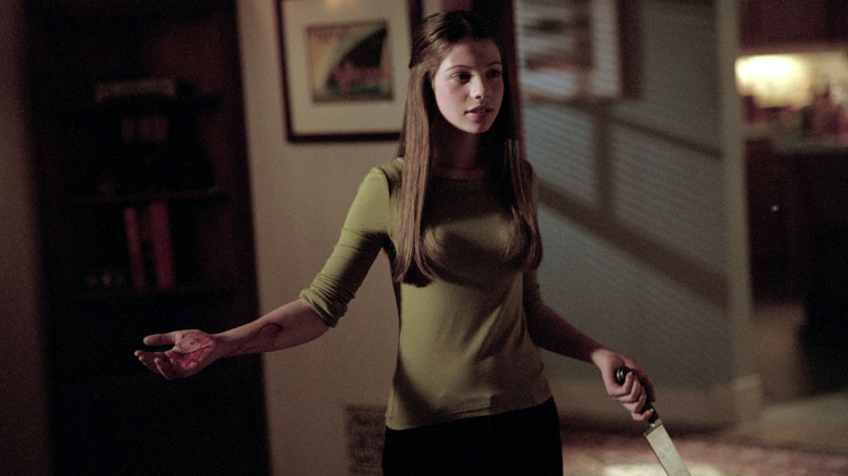 Dawn holding a knife with blood dripping down her arm on Buffy the Vampire Slayer