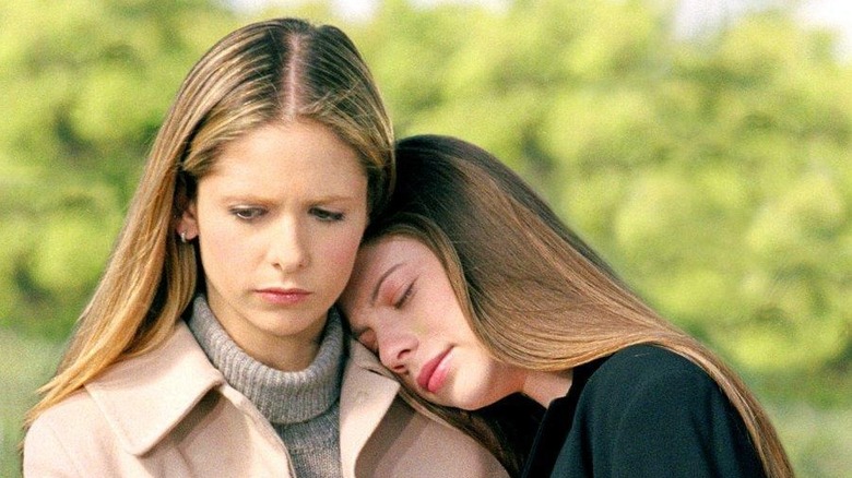 Buffy holding Dawn close at their mother's funeral on Buffy the Vampire Slayer