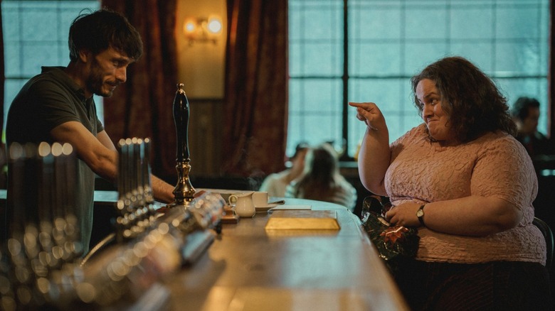 Donny speaking to Martha over the bar on Baby Reindeer