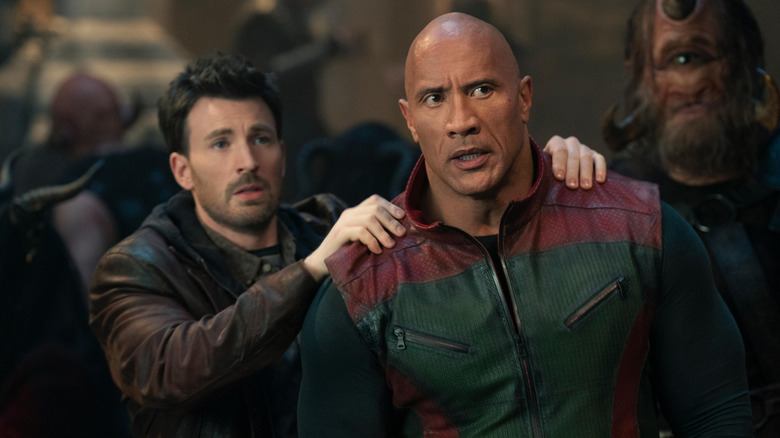 Chris Evans as Jack O'Malley rubbing the shoulders of Dwayne Johnson as Callum Drift in Red One