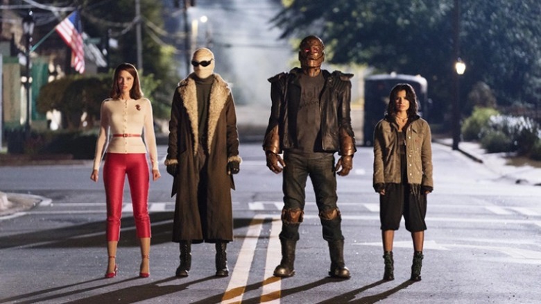 Group stands in road