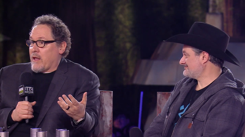 Jon Favreau and Dave Filoni being interviewed on stage at Star Wars Celebration in 2023