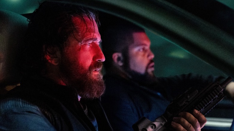 Gerard Butler's Big Nick and O'Shea Jackson Jr. as Donnie in a car in Den of Thieves 2: Pantera