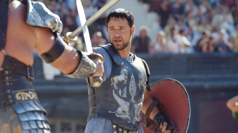 Russell Crowe as Maximus fighting in the arena in Gladiator