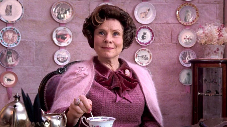 Dolores Umbridge in her pink office stirring tea in Harry Potter and the Order of the Phoenix