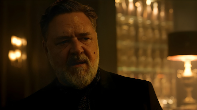 Russell Crowe as Nikolai Kravinoff looking disgusted in Kraven the Hunter