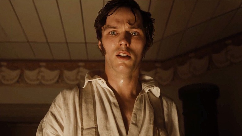 Nicholas Hoult as Thomas Hutter looking concerned and Sweaty in Nosferatu (2024)