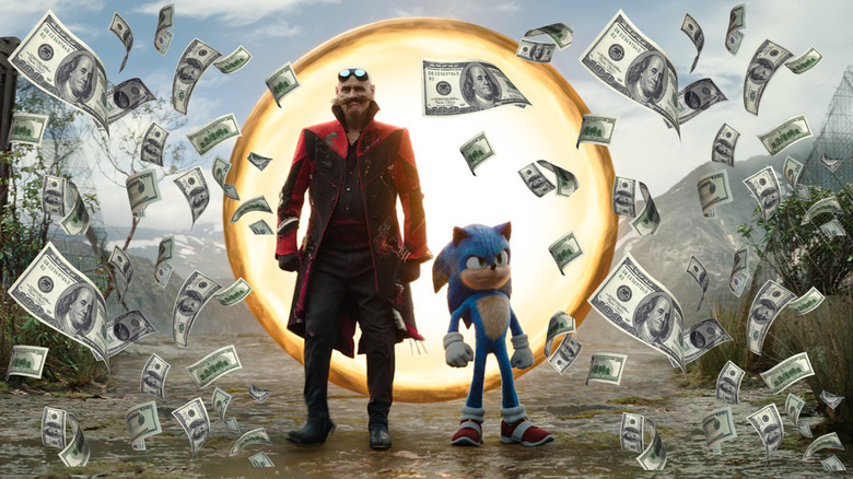 Robotnik and Sonic emerging from a ring portal surrounded by money in Sonic the Hedgehog 3