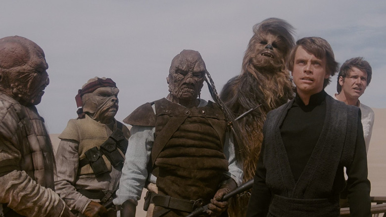 Chewbacca, Luke, and Han being held captive by Jabba's forces in Star Wars: Return of the Jedi