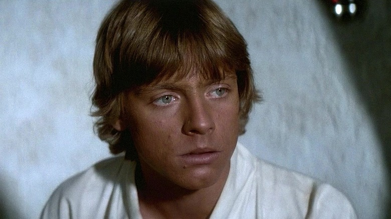 Luke listening to Obi-Wan speak in Star Wars: A New Hope