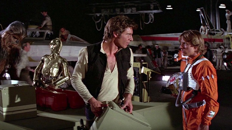 Han and Luke talking at the Rebel base in Star Wars: A New Hope